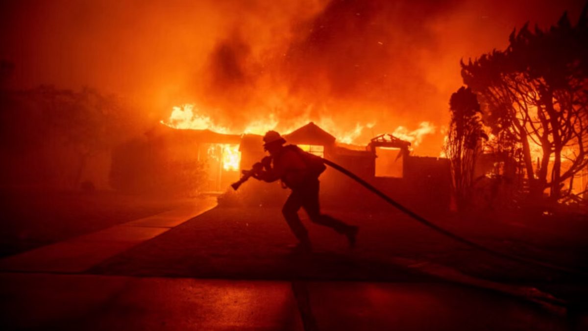 Firefighter putting out the extreme blazes.
