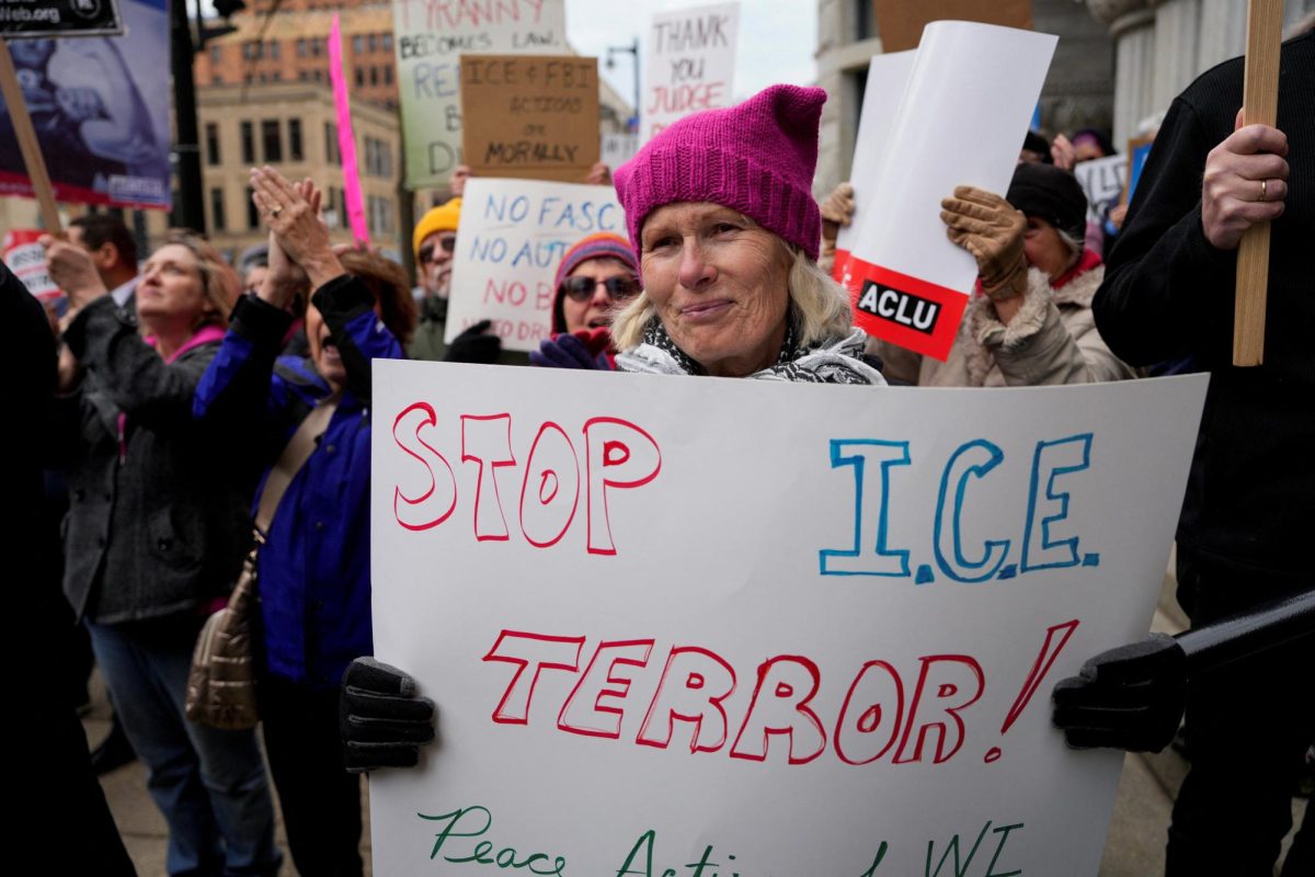 People protest outside Milwaukee Federal Building & U.S. Courthouse, after Wisconsin county judge Hannah Dugan was arrested by U.S. officials, charging her with helping a man in her court evade immigration authorities in an escalating dispute between President Donald Trump's administration and local officials over immigration enforcement, in Milwaukee, Wisconsin, U.S., April 25, 2025. REUTERS/Vincent Alban