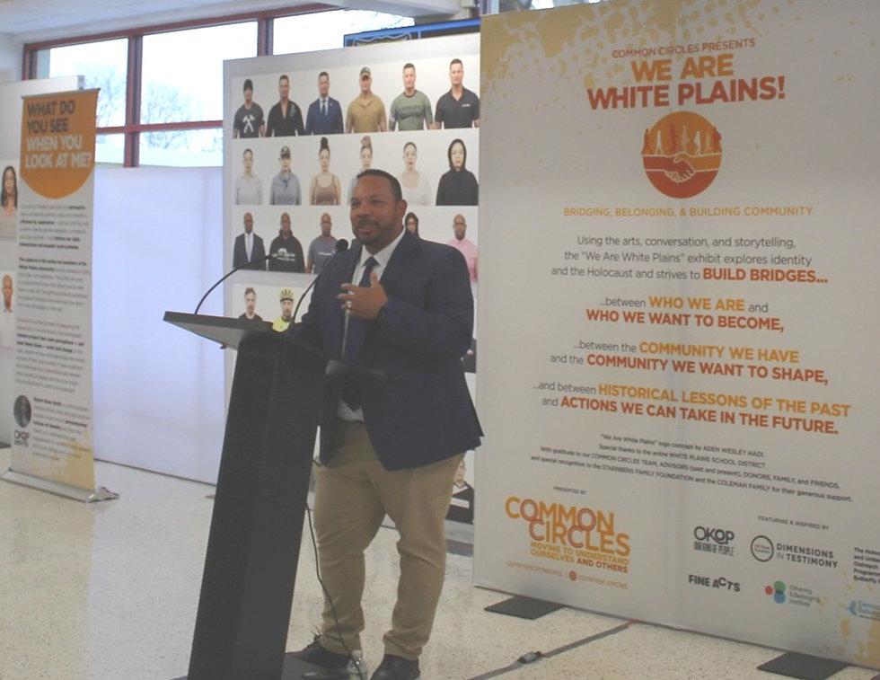 Principal Martinez speaks to students at the exhibit.
