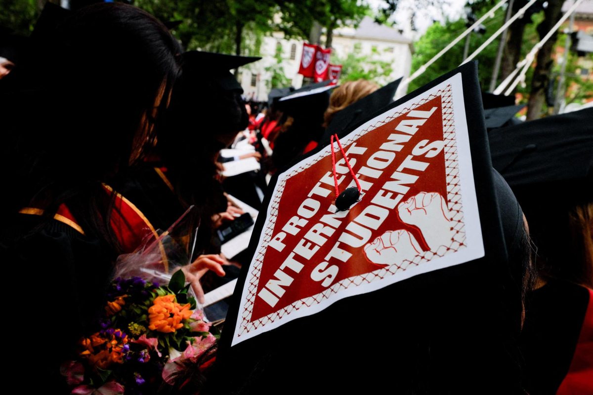 A graduating student wears their hat, decorated with a statement of support for international students, during the 374th Commencement exercises at Harvard University in Cambridge, Massachusetts, U.S., May 29, 2025. REUTERS/Brian Snyder     TPX IMAGES OF THE DAY
