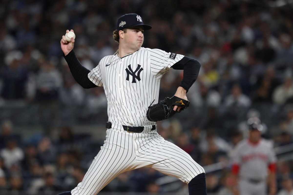 New York Yankees starting pitcher Cam Schlittler throws to the plate in the third inning against the Boston Red Sox during Game three of the Wildcard for the 2025 MLB playoffs at Yankee Stadium. Mandatory Credit: Vincent Carchietta-Imagn Images