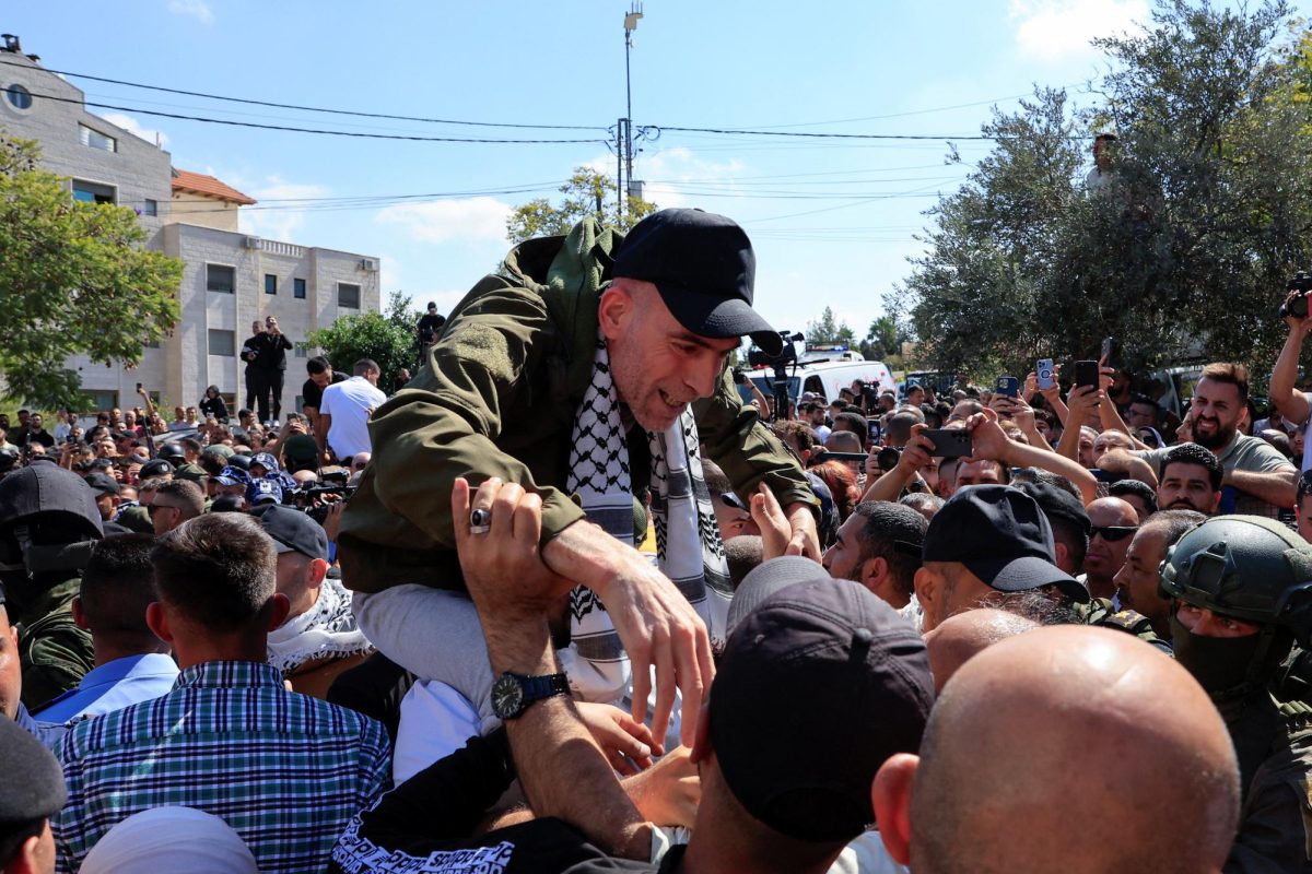 A freed Palestinian prisoner reacts after being released from an Israeli jail as part of a hostages-prisoners swap and a ceasefire deal in Gaza between Hamas and Israel, in Ramallah, in the Israeli-occupied West Bank, October 13, 2025. REUTERS/Mussa Qawasma