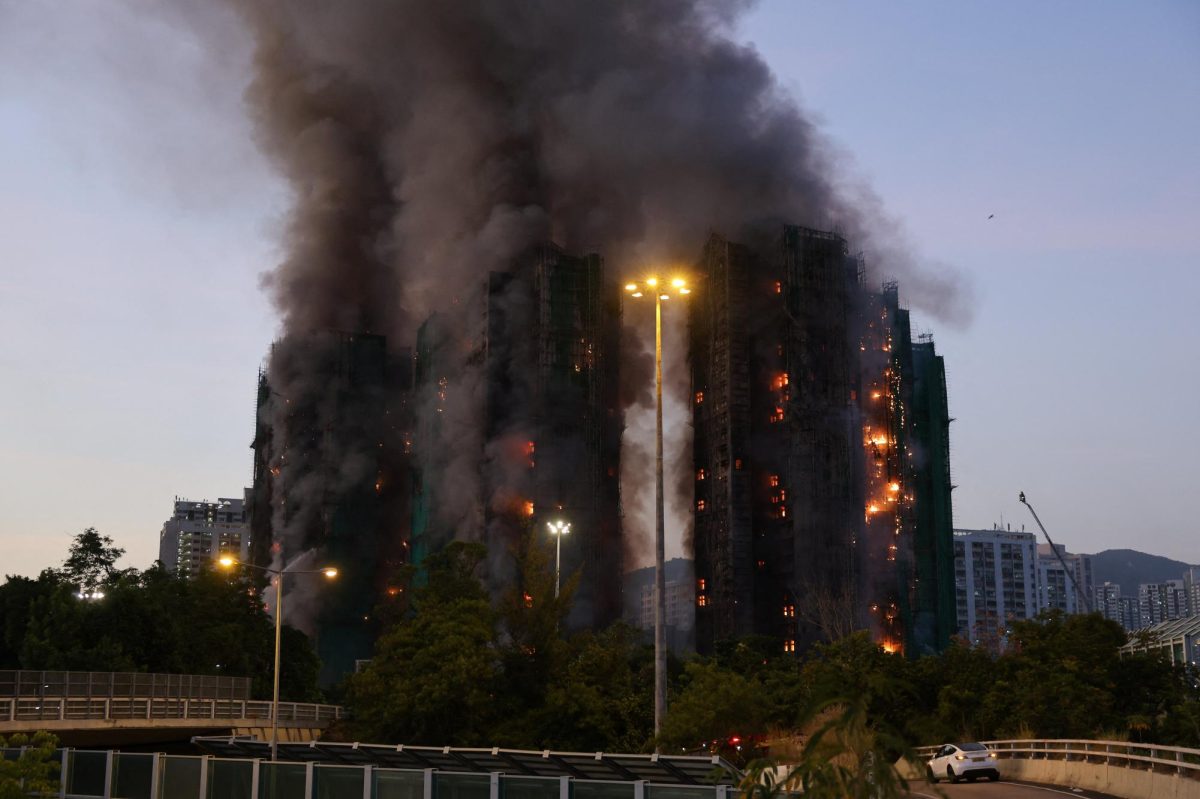 Fire burns bamboo scaffolding across multiple buildings at Wang Fuk Court housing estate, in Tai Po, Hong Kong, China, November 26, 2025. REUTERS/Tyrone Siu