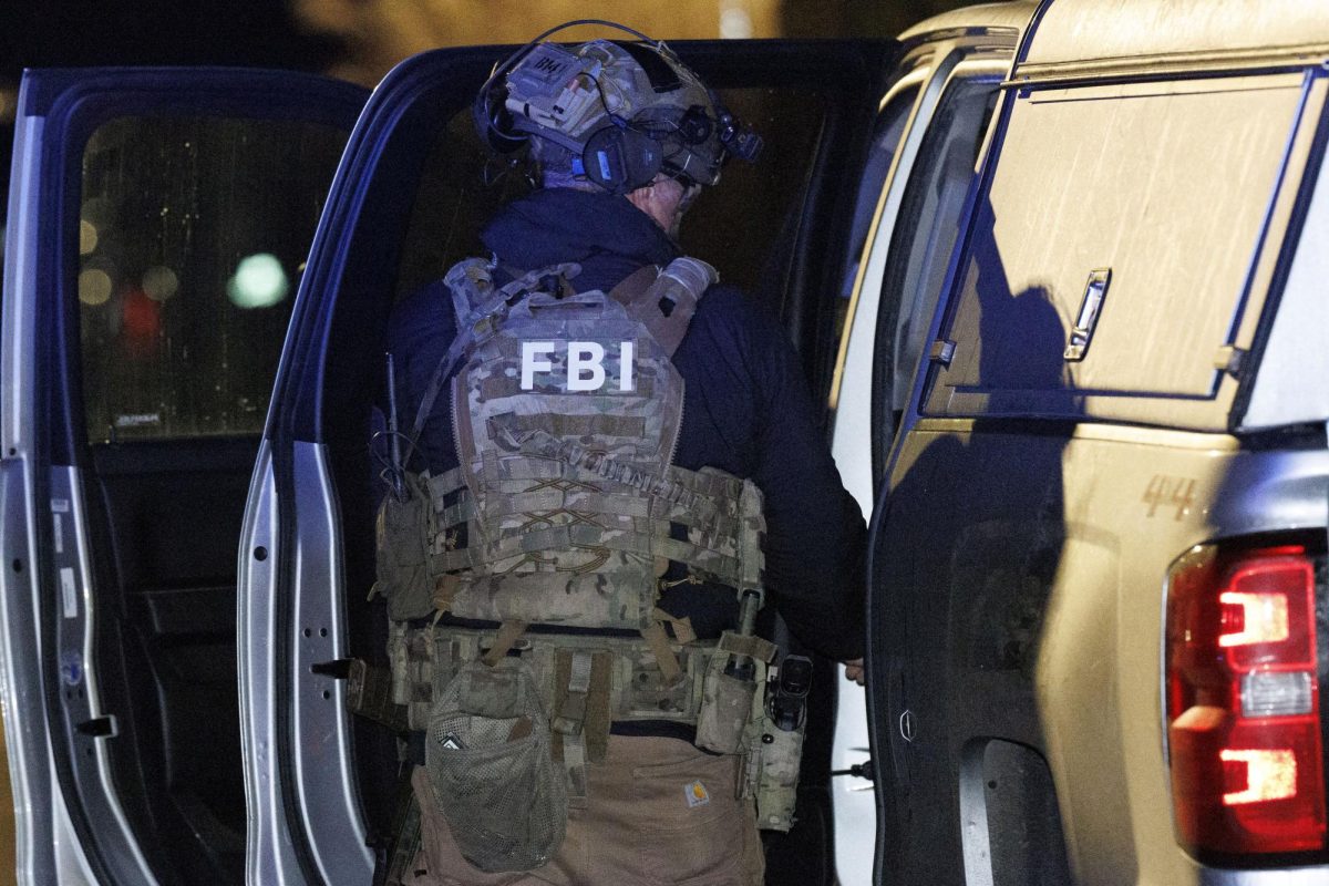 A member of the FBI returns equipment to their vehicle at a storage facility where the Brown University shooter, identified by authorities as Claudio Neves Valente, took his own life, in Salem, New Hampshire, U.S., December 18, 2025. REUTERS/CJ Gunther