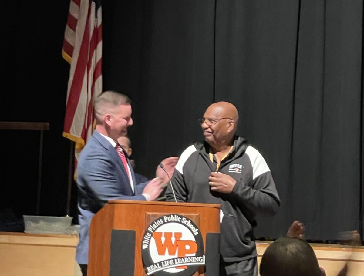 Superintendent Dr. Jospeh Ricca honors cross country coach Fred Singleton 