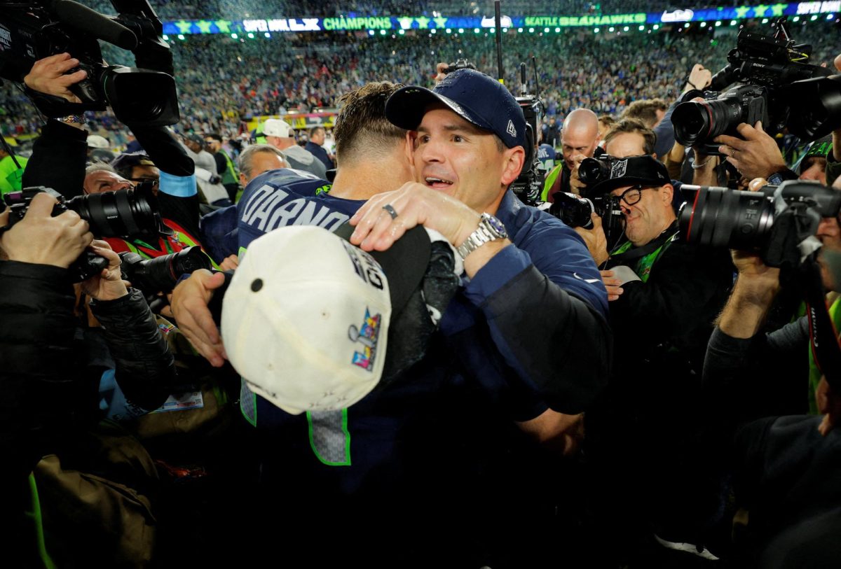 Seattle Seahawks head coach Mike Macdonald and Sam Darnold celebrate after winning Super Bowl LX.  REUTERS/Mike Blake