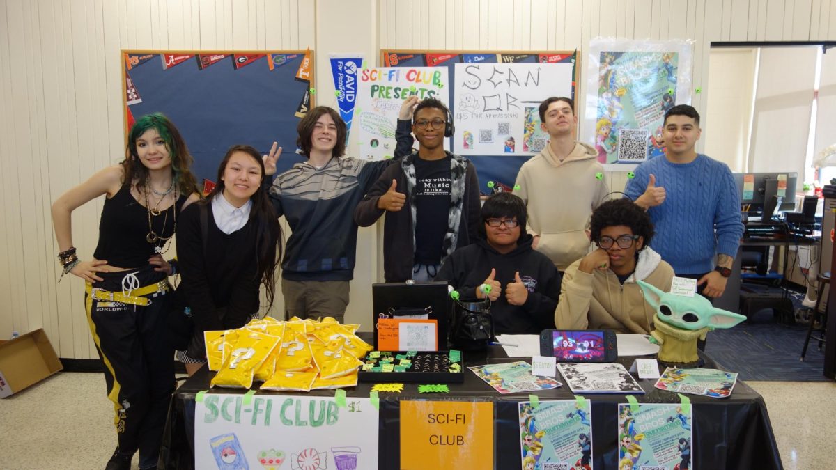 The Sci-Fi Club gathers around their table during the Tiger Community Time.