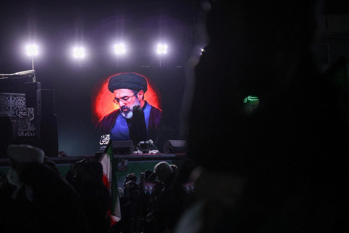 A picture of Iran's new supreme leader Mojtaba Khamenei is displayed on a screen in Tehran, March 9.  Majid Asgaripour/WANA