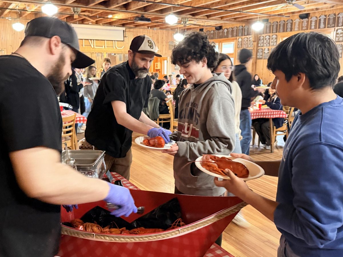 Students being served lobster at New England Music Camp.
