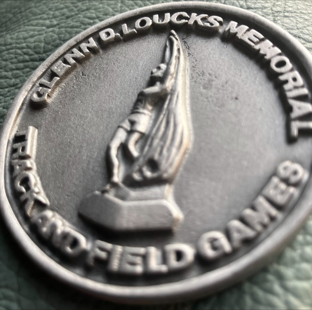 A medal from the 58th Annual Glenn D. Loucks Games, held at White Plains High School from May 7 to May 9.